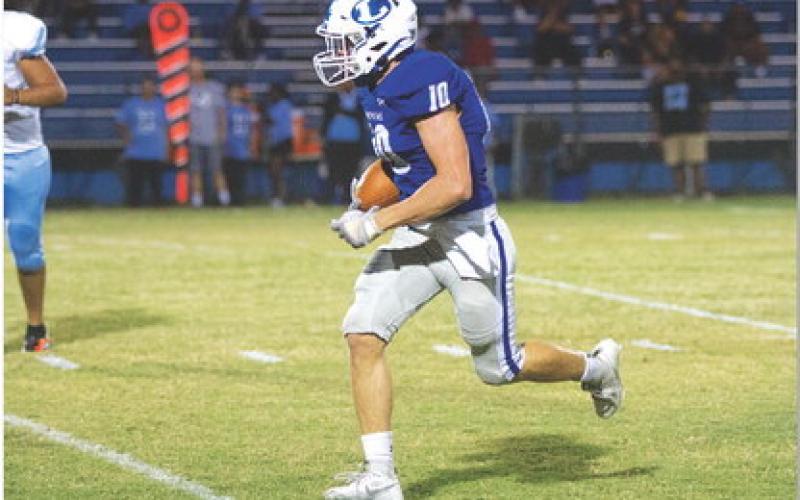 HUNTER KING | DISPATCH RECORD Brock Langford runs back his second interception in as many weeks.