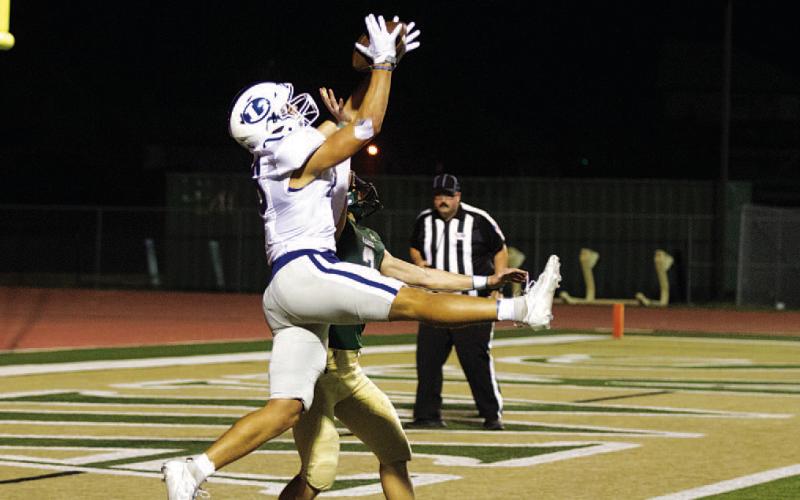 Haegan Oncken goes up over a Canyon Lake defender to secure a touchdown. HUNTER KING | DISPATCH RECORD