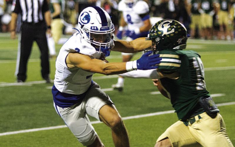Ayden Shaw makes a tackle at the line of scrimmage against Canyon Lake. HUNTER KING | DISPATCH RECORD