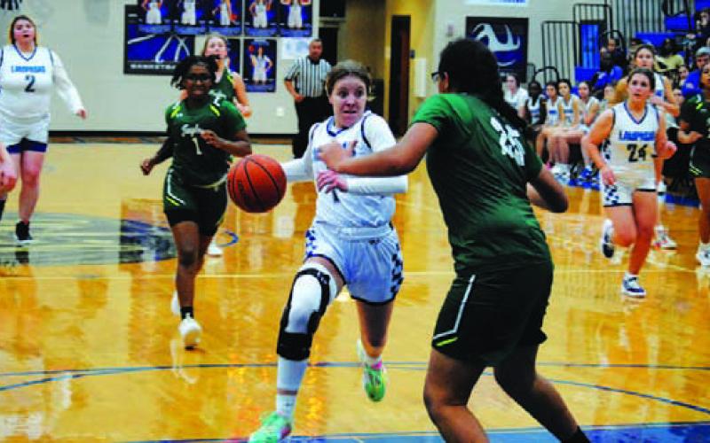 Aspen Wheeler drives in for a layup against Taylor. HUNTER KING | DISPATCH RECORD