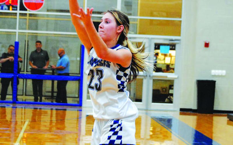 Payton Tatum releases a three-point shot with the Lady Badgers up big in the third quarter. HUNTER KING | DISPATCH RECORD