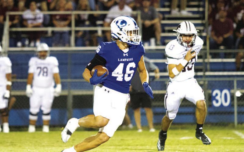 HUNTER KING | DISPATCH RECORD Haegan Oncken runs away from a Brownwood defender early in last Friday’s game.