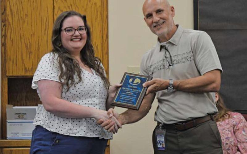 Kelli Cox was one of two Lampasas Middle School teachers to receive teacher of the year recognition. Holcomb presented her plaque Monday night at the June school board meeting. ERICK MITCHELL | DISPATCH RECORD