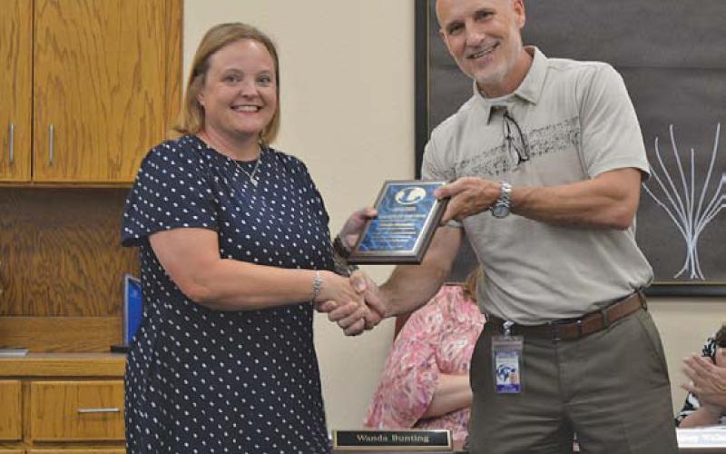 Emma Shumaker was named Hanna Springs Elementary School’s teacher of the year. She is pictured with Assistant Superintendent Dana Holcomb. ERICK MITCHELL | DISPATCH RECORD