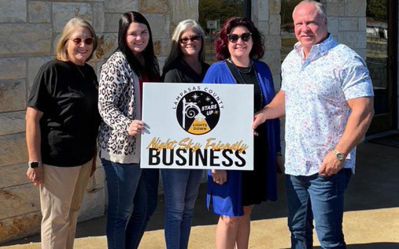 Lampasas County Friends of the Night Sky business liaison Martha Noell, at left, is pictured with Harrell &amp;amp; Associates team members, left to right, Bailey Oldham, Evette Bowen, Jamie Garrett and owner Jack Harrell, whose firm received the Night Sky Business Award. courtesy photo