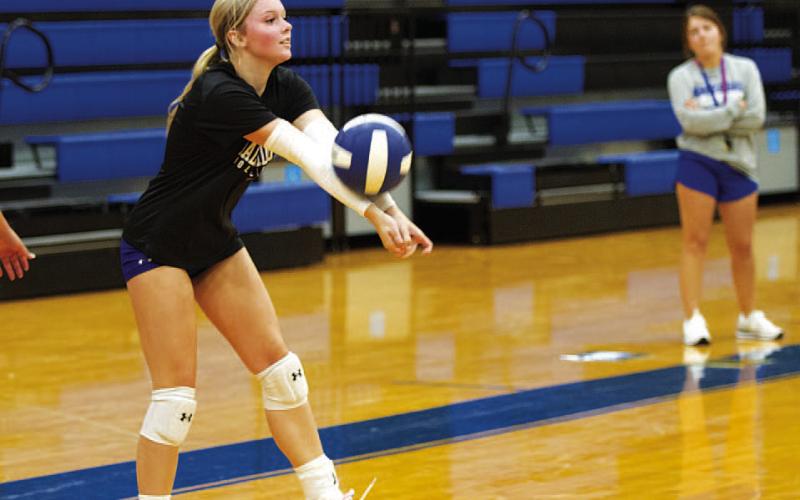 HUNTER KING | DISPATCH RECORD Scout Barton works on serve receive during volleyball practice Monday morning.