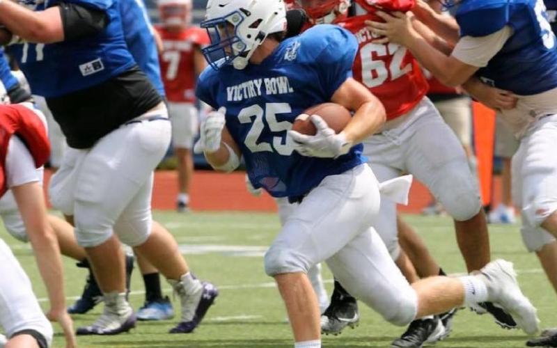 Badger grads play together one last time on gridiron