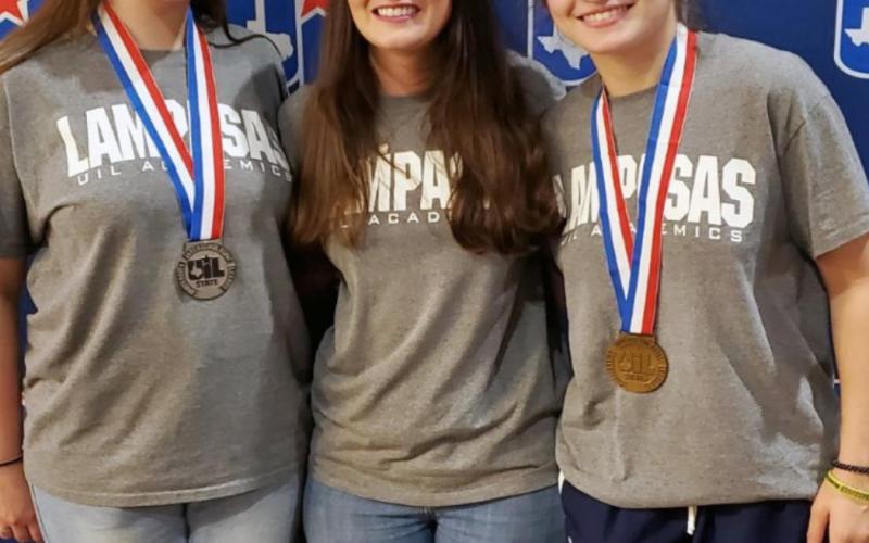 Lydia Breuer, left, and Amelia Stanley, at right, stand with the LHS newspaper adviser and UIL coach Kayla Cain after placing at the state meet. VERONICA BUTLER | DISPATCH RECORD
