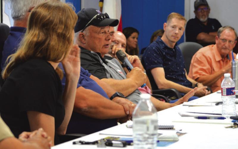 Kempner Water Supply Corp. board president Dennis Kliza, in center with microphone, responds to member concerns during last Wednesday’s regular meeting. ERICK MITCHELL | DISPATCH RECORD