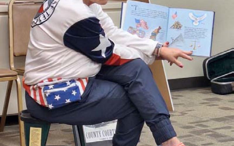 Community members such as District Clerk Edith Wagner Harrison were on hand to read books about faith, family and freedom. COURTESY PHOTO | DIANNE MOUW