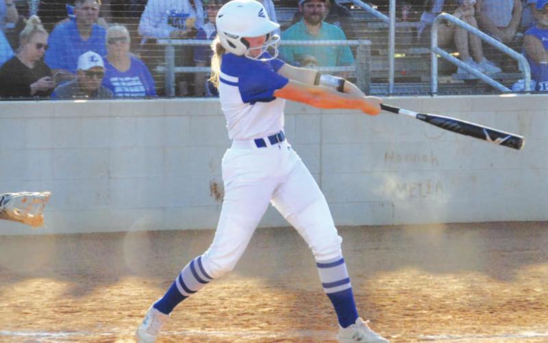 Kamryn Kothmann swings at a pitch during the Lady Badgers’ game last week against Brownwood. HUNTER KING | DISPATCH RECORD