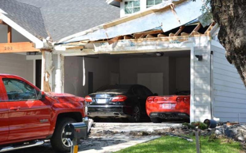 Damage at 203 S. Howe St. was visible in May after a car crashed into the house. Police alleged the driver was intoxicated and going 117 mph in the residential neighborhood. FILE PHOTO