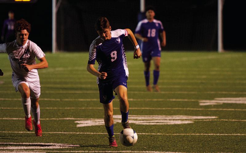 Keaton Black dribbles past a China Spring defender on the wing. HUNTER KING | DISPATCH RECORD