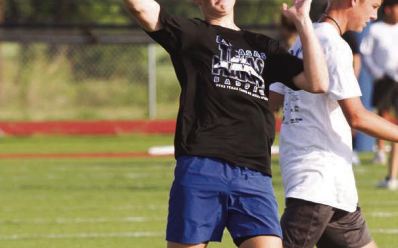 Incoming freshman Kaiser Morua launches a pass on Monday morning during a three-day camp held at Lampasas High School. ERICK MITCHELL | DISPATCH RECORD
