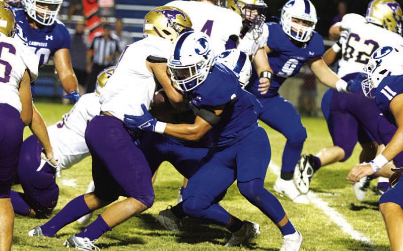 HUNTER KING | DISPATCH RECORD Elijah Calderon makes the tackle on the Marble Falls ball carrier.