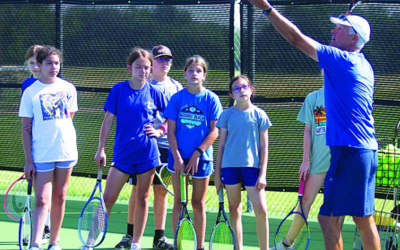 FILE PHOTO Peiser also runs a tennis camp each summer to help young Badgers improve their game.