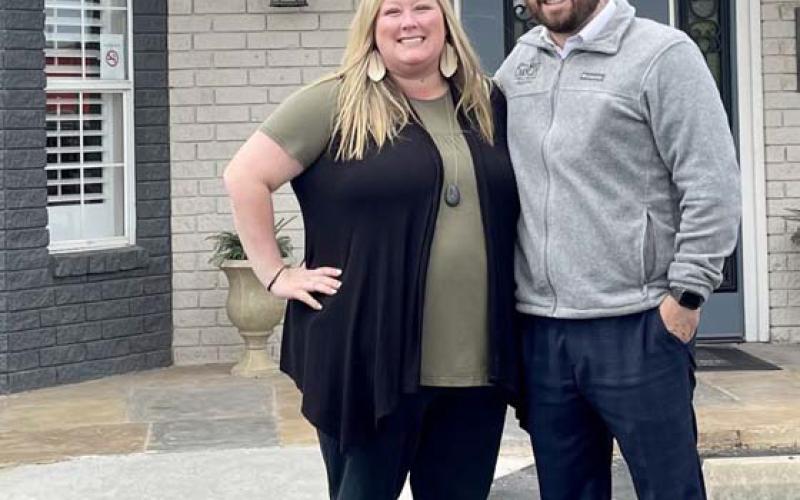 Courtney and Zach Carnley stand in front of Viss Family Funeral Home in Copperas Cove. The couple are new owners of the business, which will become the second location for Sneed-Carnley Funeral Chapel and Cremations. COURTESY PHOTO