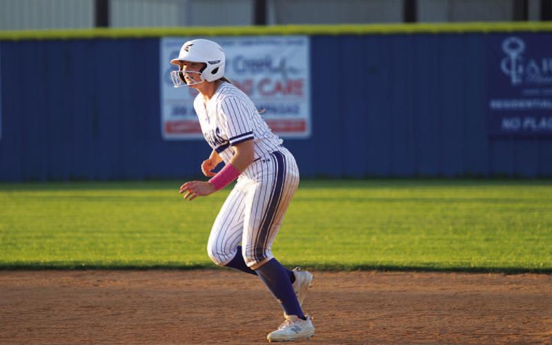 Kamryn Kothmann takes her lead off second base after a first-inning single against Burnet. HUNTER KING | DISPATCH RECORD
