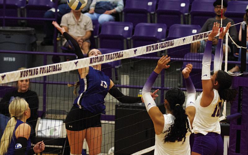 HUNTER KING | DISPATCH RECORD Abbey Green swings for a kill through the Marble Falls block during the first set in the girls’ second-to-last match this season.