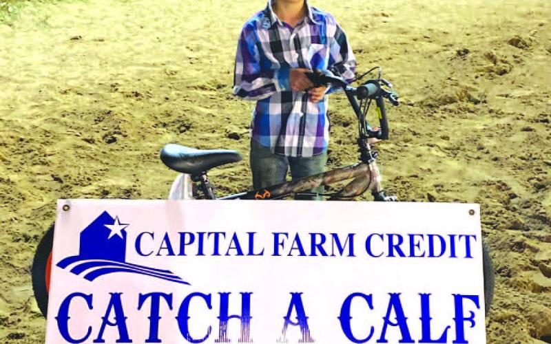Gabriel Moore won the 6 and under calf scramble on March 25 at the Lometa Diamondback Jubilee Rodeo. He earned a bike for his efforts. The event was sponsored by Capital Farm Credit. COURTESY PHOTO | MARCUS AMTHOR
