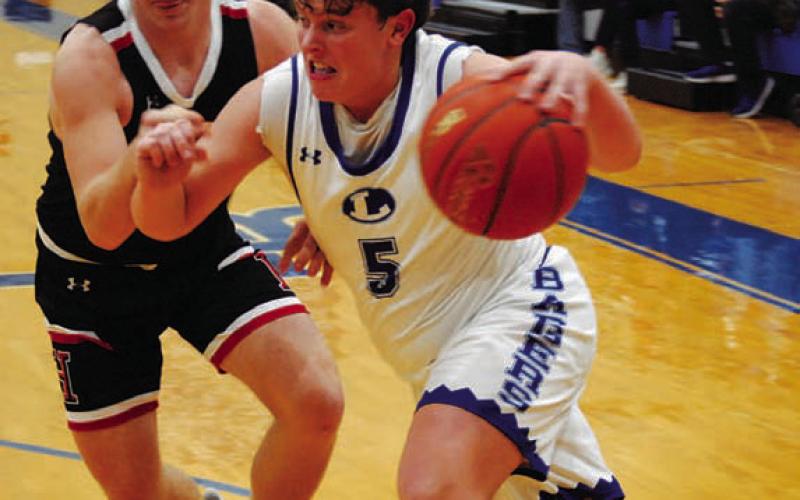 Aidan Nuckles dribbles past a defender. HUNTER KING | DISPATCH RECORD