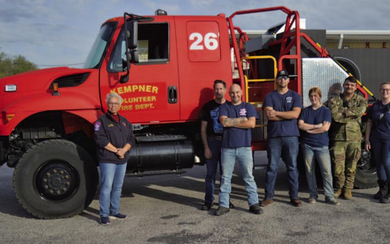 Kempner VFD Chief Connie Green stands at left, alongside Kempner volunteer firefighters, in front of the new brush truck the department received earlier this month. ERICK MITCHELL | DISPATCH RECORD