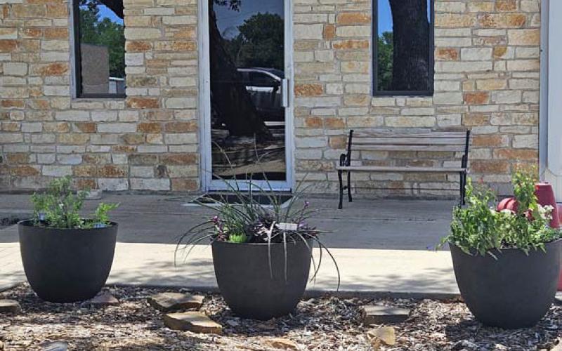 Browning Community Garden Club members have placed decorative planters in the flower bed at the Kempner Volunteer Fire Department building as part of a beautification project in honor of National Garden Week. COURTESY PHOTO