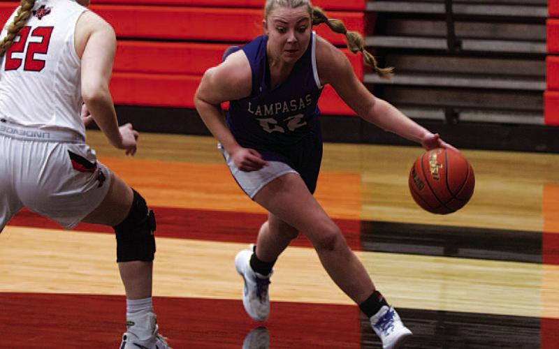 HUNTER KING | DISPATCH RECORD Kennedi Smart dribbles around a defender to drive the baseline.
