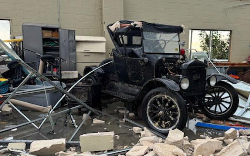 A cinder block and metal workshop on Burnet County Road 223 sustained damage, as tornadic winds ripped off the roof and twisted steel beams, but this antique sheriff vehicle stored inside should be salvageable. COURTESY PHOTO | FACEBOOK