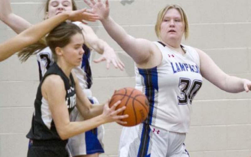 Kyliegh Ball (30) defends the lane against the Lady Falcons on Tuesday. JEFF LOWE | DISPATCH RECORD