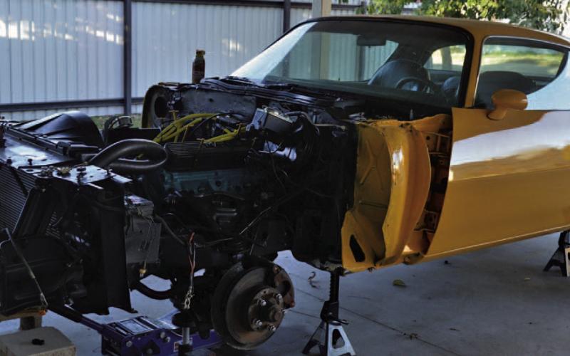 ERICK MITCHELL | DISPATCH RECORD Howard Tucker said this 1976 Pontiac Trans Am restoration is in the closing stages, with reassembly of the vehicle the only task that remains before the project is finished.
