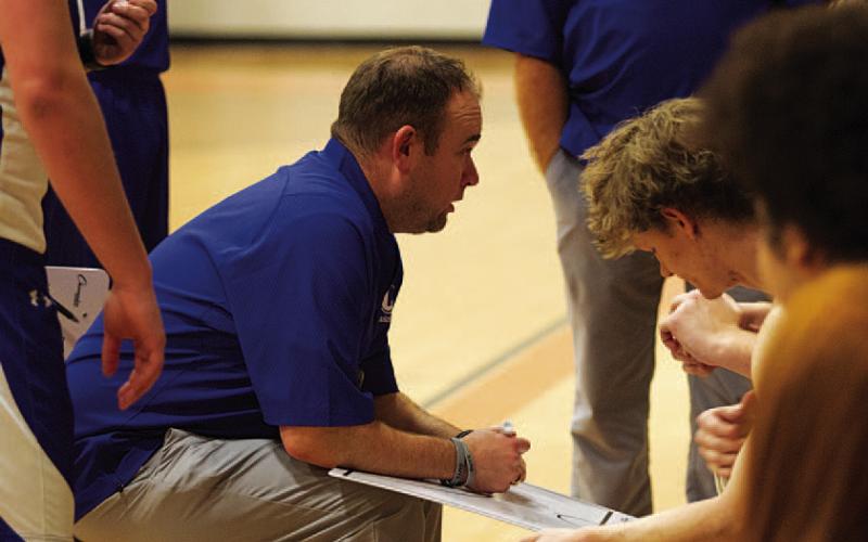 HUNTER KING | DISPATCH RECORD Aaron Nuckles addresses his team during a timeout.