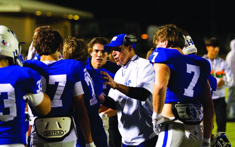Defensive coordinator Cory Warner coaches his group against Canyon West Plains. HUNTER KING | DISPATCH RECORD