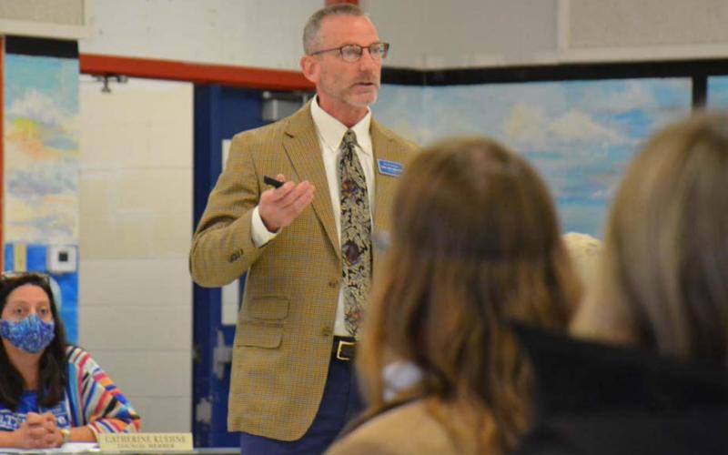 At a town-hall meeting Monday, City Manager Finley deGraffenried explains the city’s efforts during February’s winter storm. Seated behind deGraffenried is Lampasas City Councilwoman Cathy Kuehne. MONIQUE BRAND | DISPATCH RECORD