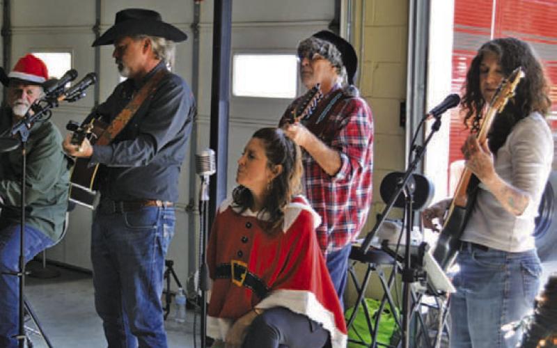 The “Lampasas All-Stars” provided Christmas tunes during Monday’s holiday lunch and toy drive at the Lampasas Fire Station. ERICK MITCHELL |DISPATCH RECORD