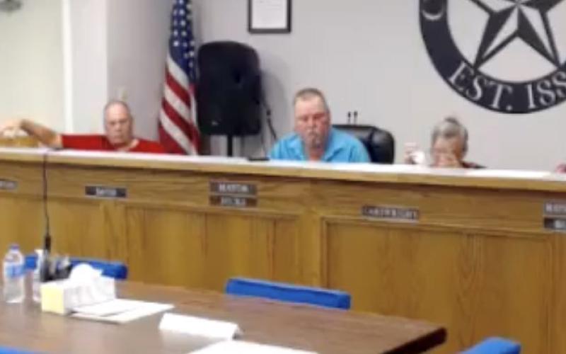 From left are City Attorney Arthur Bryan, Lometa council member Johnny Towerton, Mayor Stephen Hicks, council members Roni Cartwright, Bob Butler and James Dickison ss they discuss a water rate increase during Monday’s called meeting. CITY OF LOMETA ZOOM MEETING SCREENSHOT