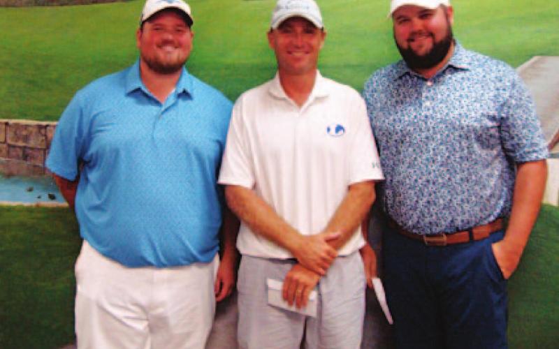 Logan Fox, left, Justin Schulze and Stayton Lindeman pose for a photo after finishing on the podium in the tournament. COURTESY PHOTO