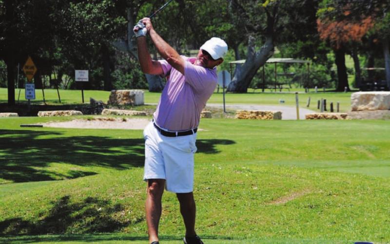 Mike Wiley tees off on the first hole during Saturday’s action. HUNTER KING | DISPATCH RECORD