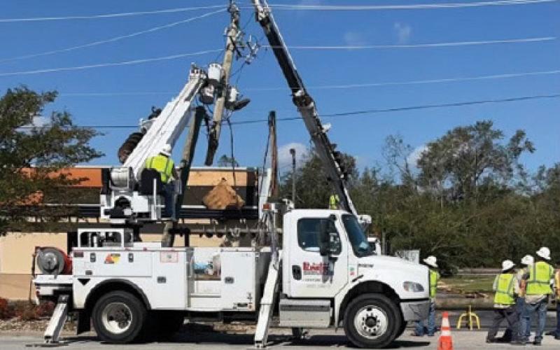 courtesy photo LineTec Services workers attempt to resurrect a collapsed power pole in the aftermath of Hurricane Helene. Lampasas resident Armando Rosales, who is a LineTec Services lineman, was part of the relief efforts.