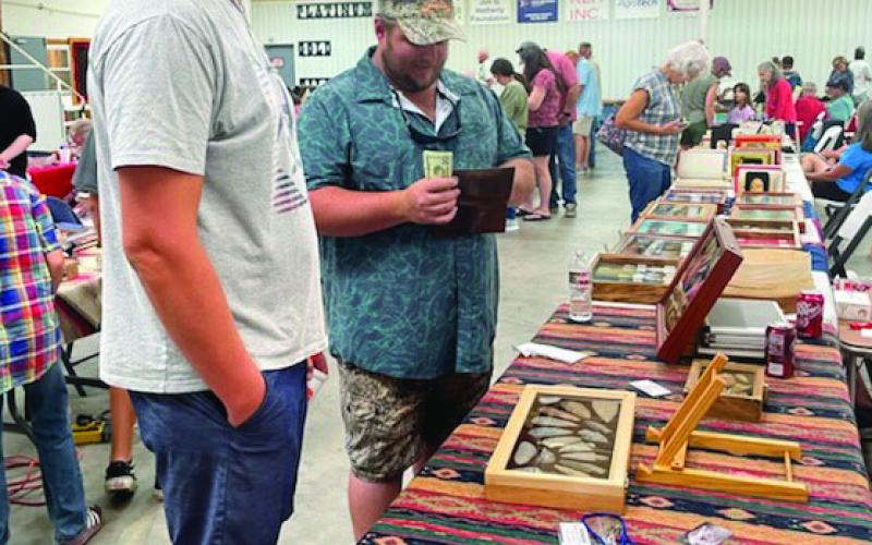 LIBBY BLUNTZER | COURTESY PHOTO Collectors and vendors were plentiful at Saturday’s Indian Artifact &amp;amp; Mineral and Gem Show. Arrowheads and jewelry were among the many items on display.