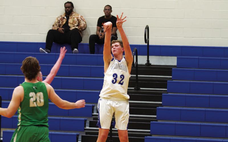 Beau Patterson shoots a three from the corner in the fourth quarter of the freshman team’s win over Burnet. HUNTER KING | DISPATCH RECORD