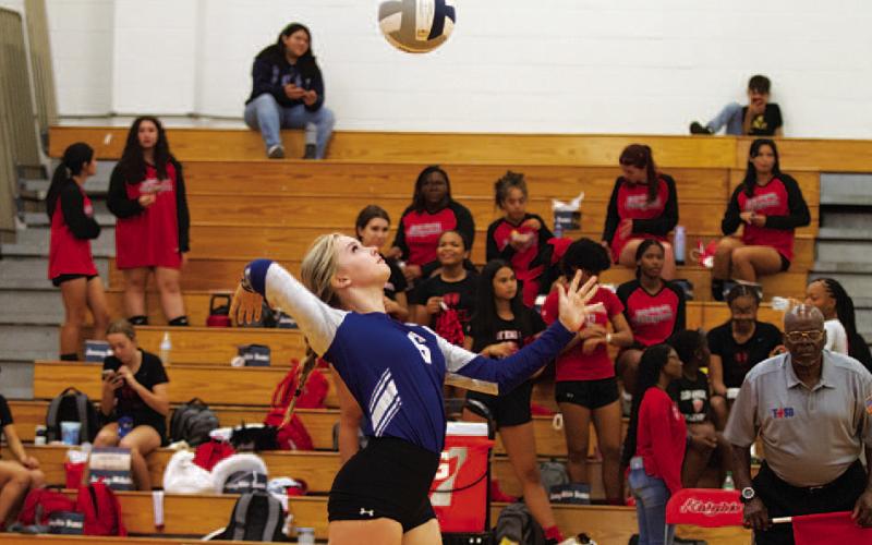 Scout Barton secures an ace for Lampasas in this week’s match. HUNTER KING | DISPATCH RECORD