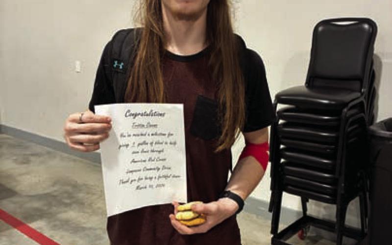 Tristan Owens received a certificate for having reached the one-gallon mark in blood donations. COURTESY PHOTO