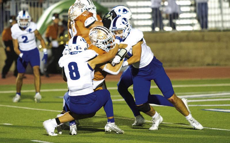 Elijah Calderon (8) and Landon Richardson (11) are in on the tackle of an Alice ball carrier. HUNTER KING | DISPATCH RECORD