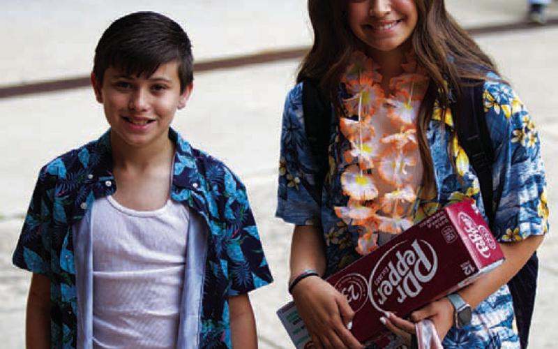 HUNTER KING | DISPATCH RECORD Caiden Perry, left, and Hadlie Perry are dressed for summer vacation as they head into Lampasas Middle School on the last day Thursday morning.