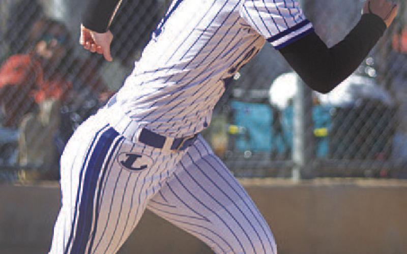 Bre Quarles sprints out of the box after laying down a sacrifice bunt. HUNTER KING | DISPATCH RECORD