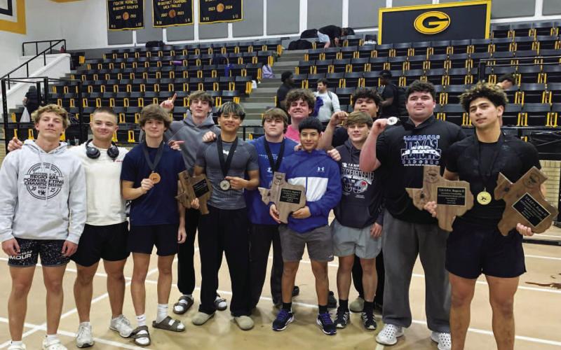 COURTESY PHOTO | LAMPASAS ATHLETICS FACEBOOK The boys’ powerlifting team shows off their plaques and medals from the regional meet last week.