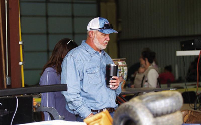 Brad Harwell peruses the auction items that were on display during the Kempner Volunteer Fire Department’s 46th Annual BBQ and Auction Fundraiser. HUNTER KING | DISPATCH RECORD