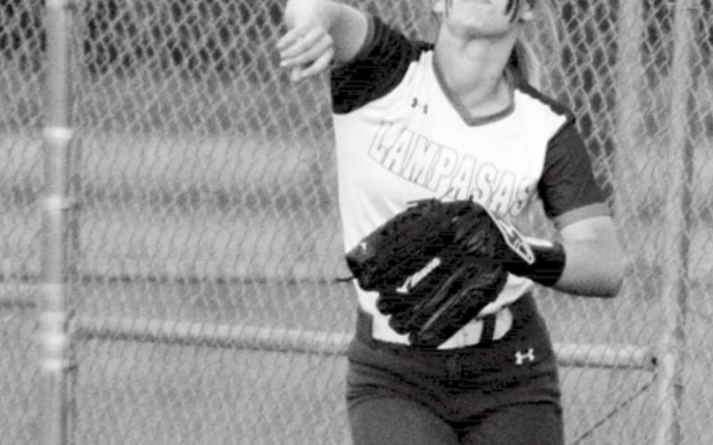 Bre Quarles makes a throw from right field