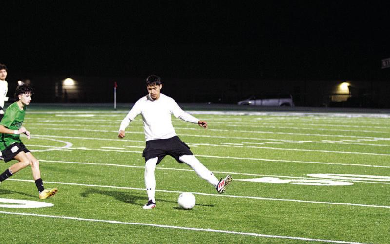 Alan Fuentes plays a backheel pass to a teammate. HUNTER KING | DISPATCH RECORD